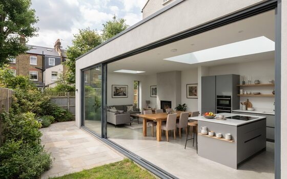 A completed Bayocorp rear extension, open to the garden through full-width sliding doors
